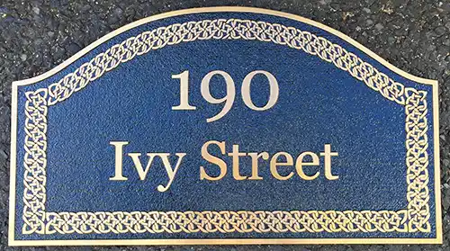 Bronze cast metal sign with gold Celtic border