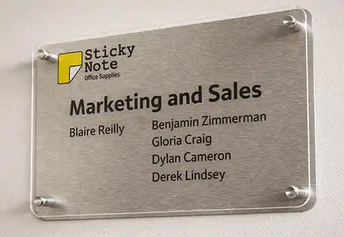 Clear Acrylic Sign Held over a Backing Board
