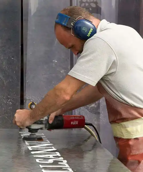 Polishing a Slate Sign