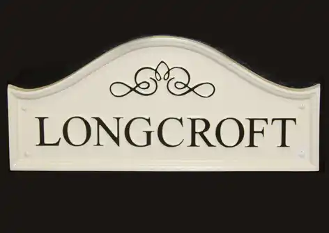 title here Dome top cast sign with scroll detail