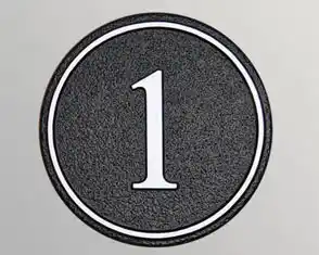 Round cast house number sign