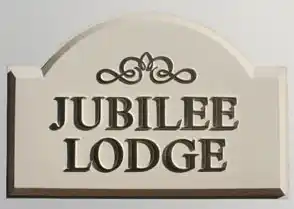 Cast arch top house sign