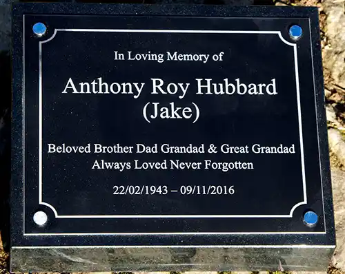 Black plaque on memorial wedge
