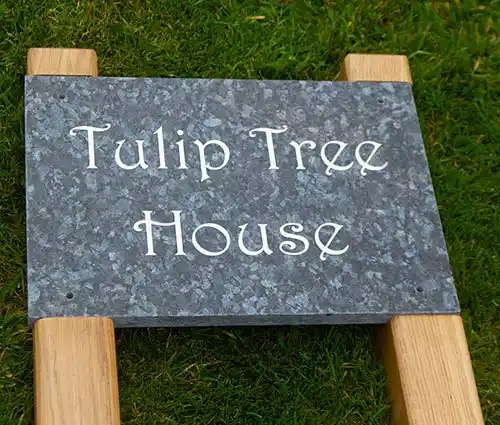 Granite sign cut into posts