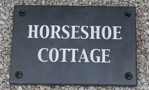 Slate house sign with countersunk holes