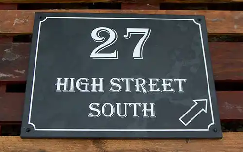 This slate house sign also has a border Slate Address Sign with Arrow