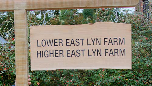 This rustic sign was hanging from a rustic wooden post Large Rustic Wooden Sign